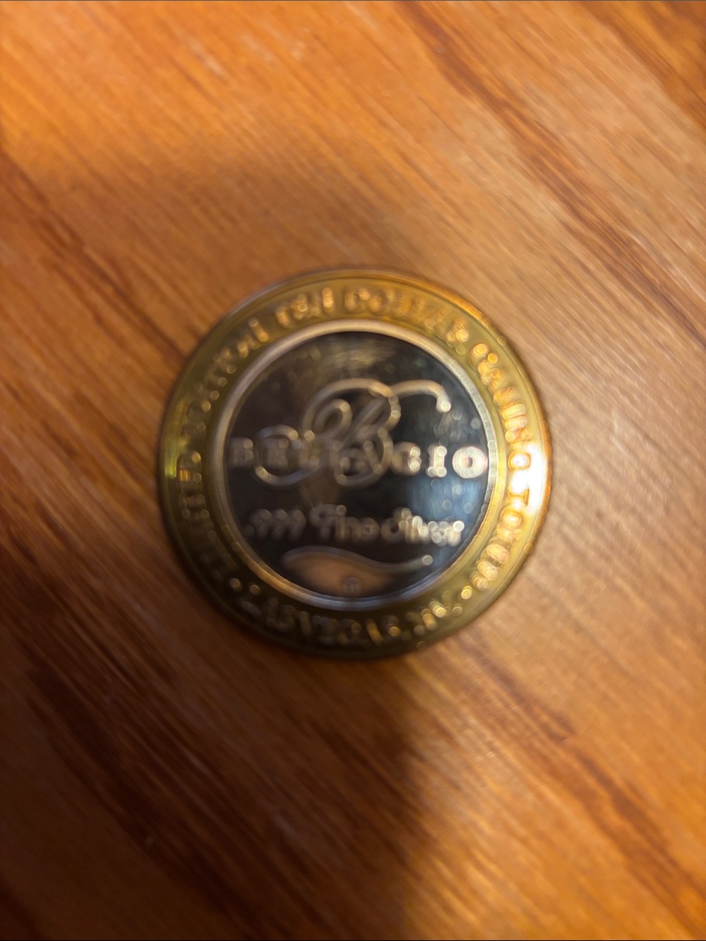 Bellagio .999 fine silver inside token and the outter is gold tone